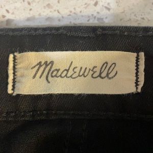 Very black, curvy super skinny Madewell jeans.